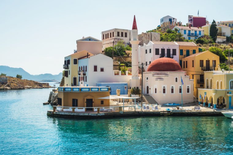 View over the houses and mosque on Greek islands Kastelorizo and the sea from the bay