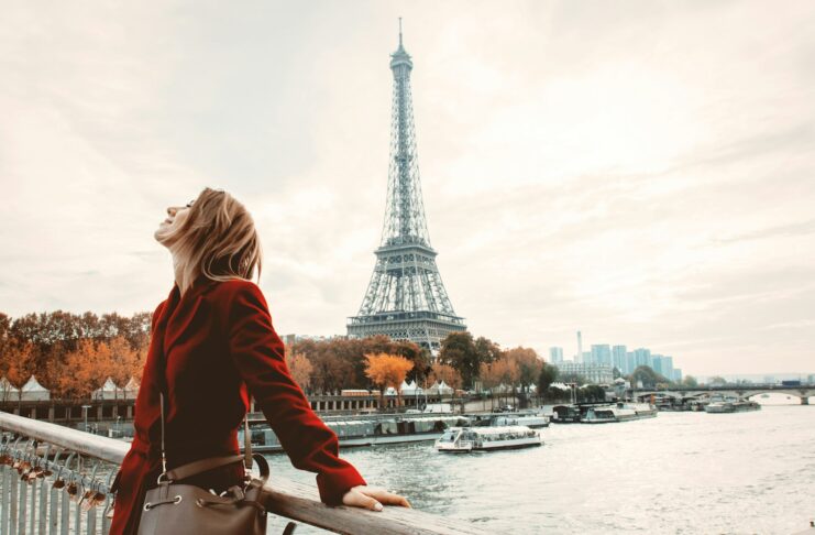 Style girl in Paris with Eiffel tower on background